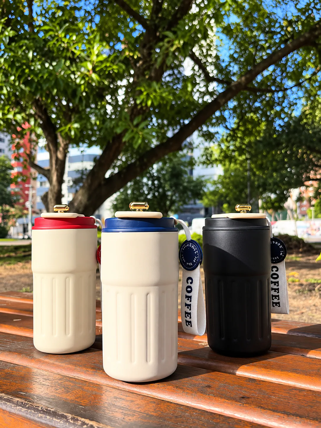 Three insulated tumblers engraved with Coffee